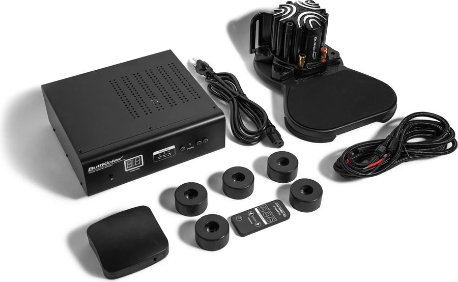 Le Buttkicker Wireless Couch Kit met à disposition un amplificateur, un vibreur et un émetteur sans-fil.