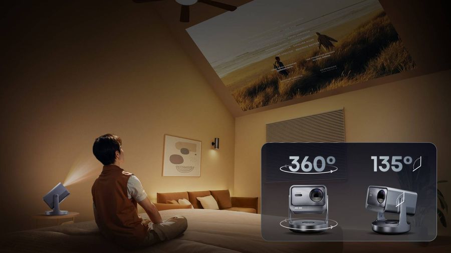 Vidéoprojecteur Hisense C2 Pro orientable Homme regardant un film projeté au plafond par le vidéoprojecteur Hisense C2 Pro orientable à 360°.