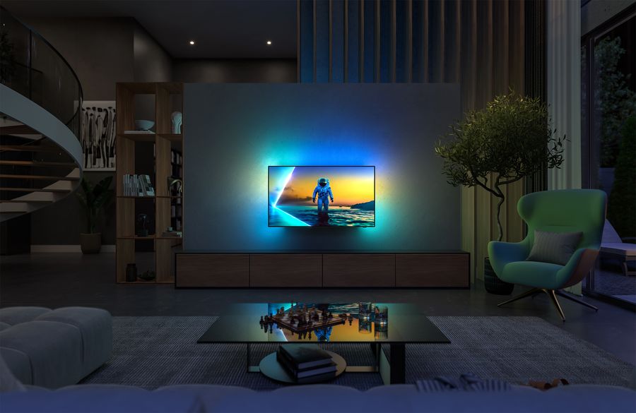 Téléviseur OLED Philips 42OLED810 affiché dans un salon moderne, avec éclairage Ambilight dynamique activé.