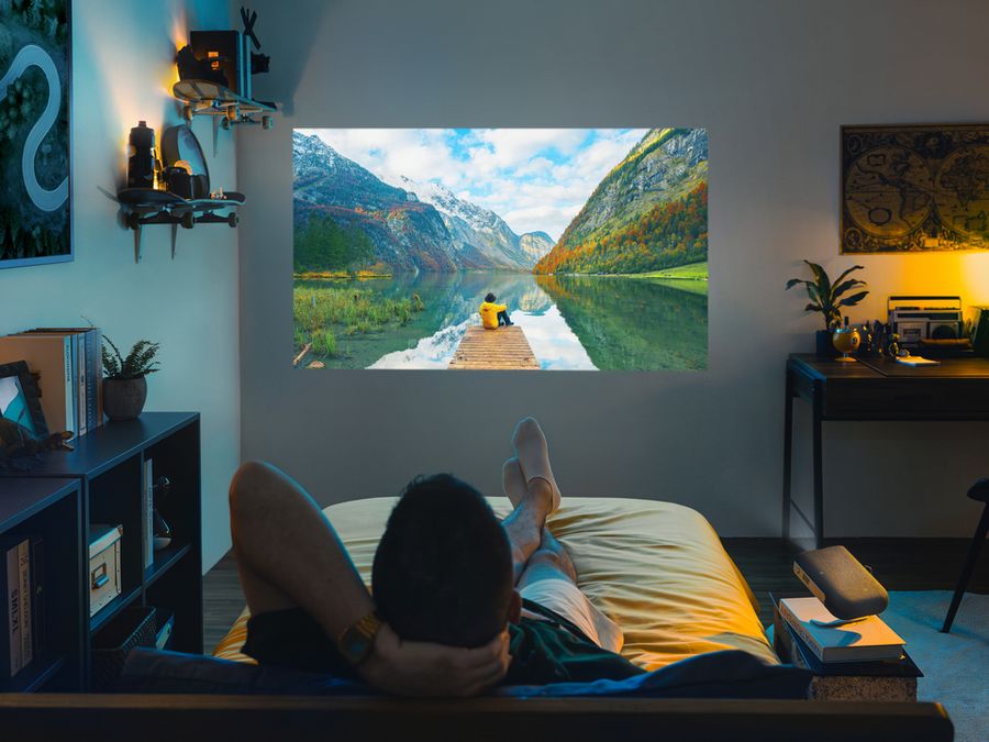 ViewSonic M1S ultra-portable projector in a bedroom setting ViewSonic M1S ultra-portable projector in a bedroom setting