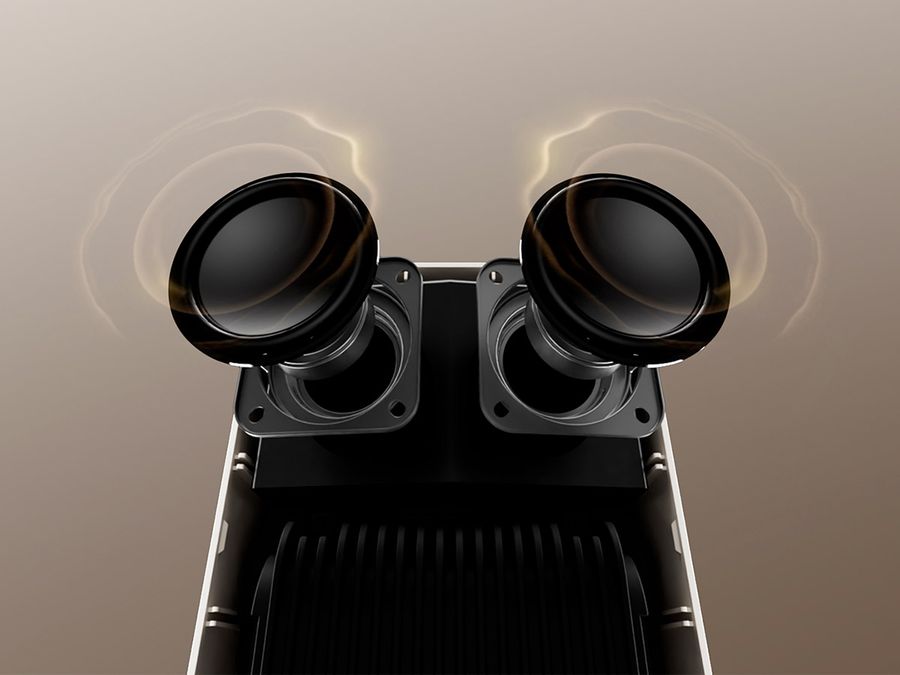 Vue interne des haut-parleurs 2 x 5 W du mini projecteur Xming Page Two, conçus avec Boston Acoustics et compatibles Dolby Audio.